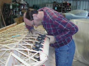 Clamping the leading edge ply.