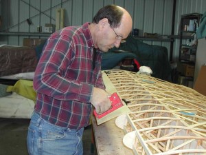 Don stapling the leading edge to upper false spar.